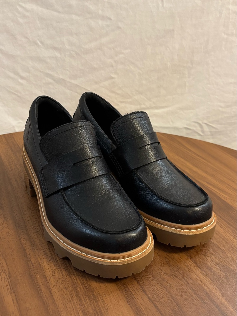 Sorel Black Leather Lug-Sole Penny Loafers with Tan Lug Sole